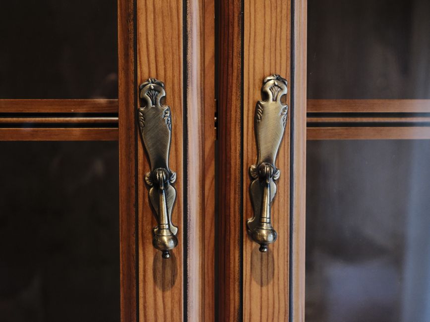 Close up of custom kitchen cabinet hardware and brass handles
